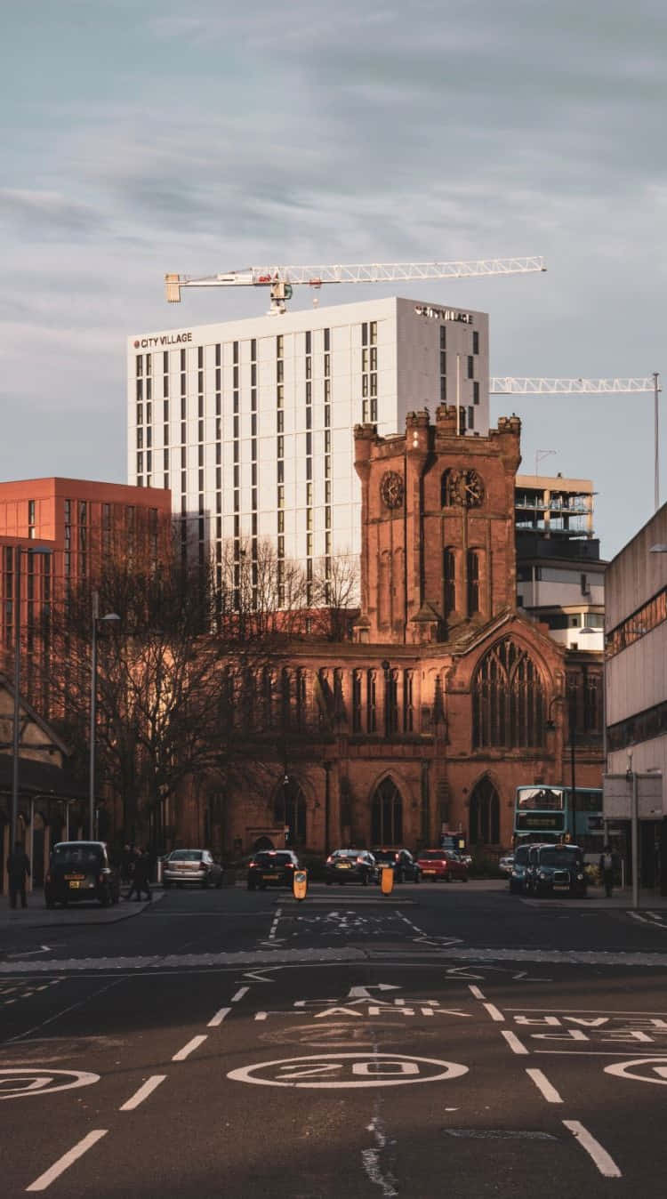 Vibrant Sunrise Over Coventry Cityscape Wallpaper