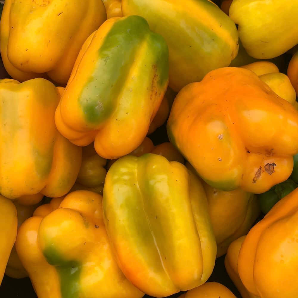 Vibrant Yellow Bell Pepper On A Dark Background Wallpaper