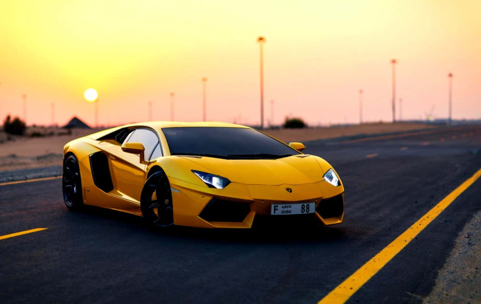 Vibrant Yellow Sports Car On City Street Wallpaper