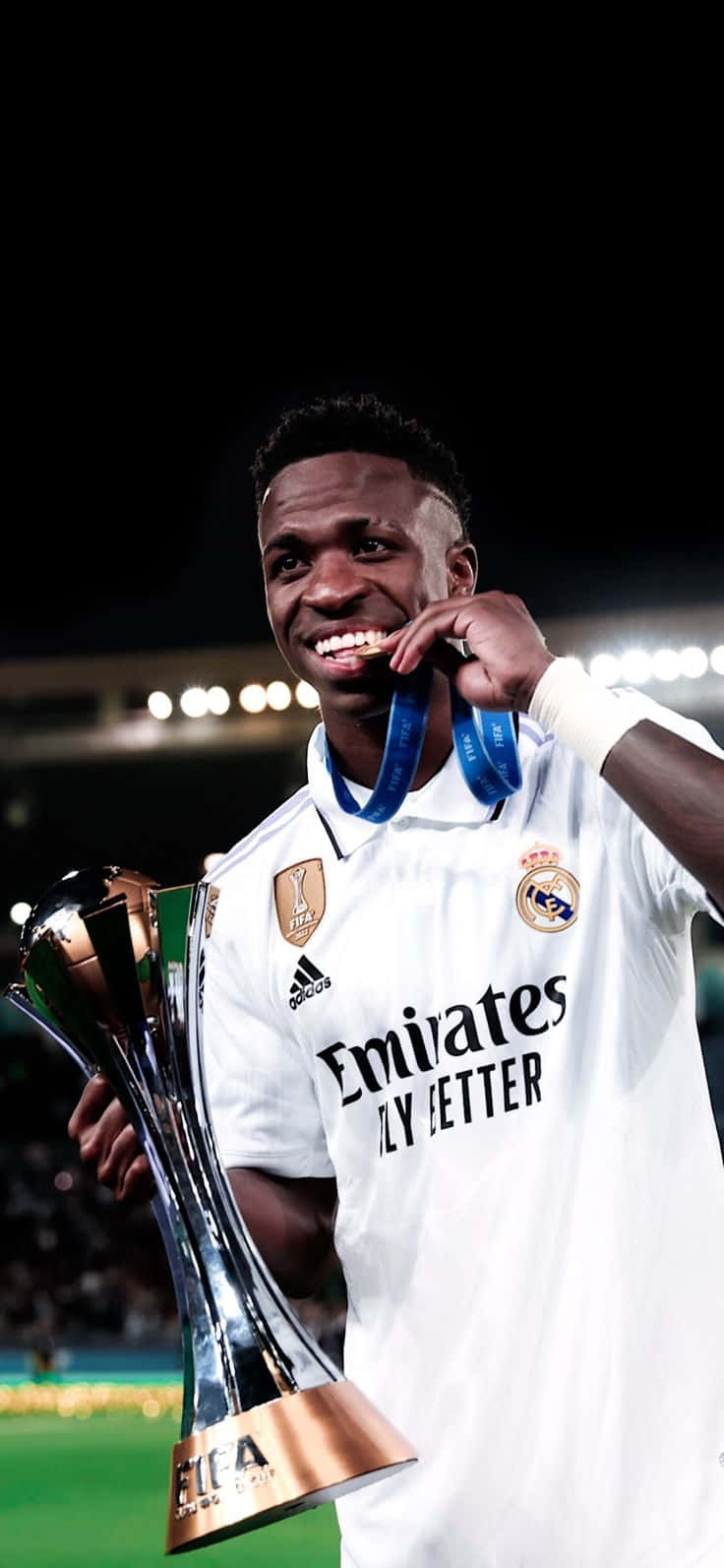 Vinicius Jr Celebratingwith Trophy Wallpaper