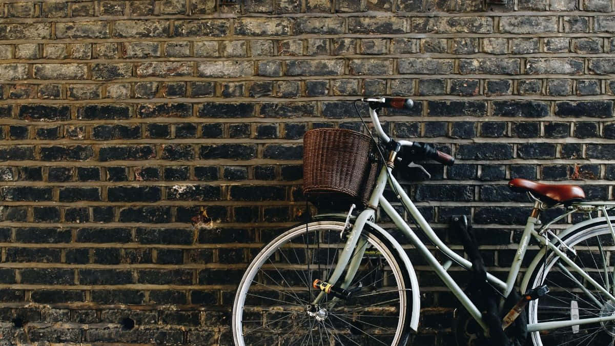 Vintage Bicycle Against Brick Wall Wallpaper