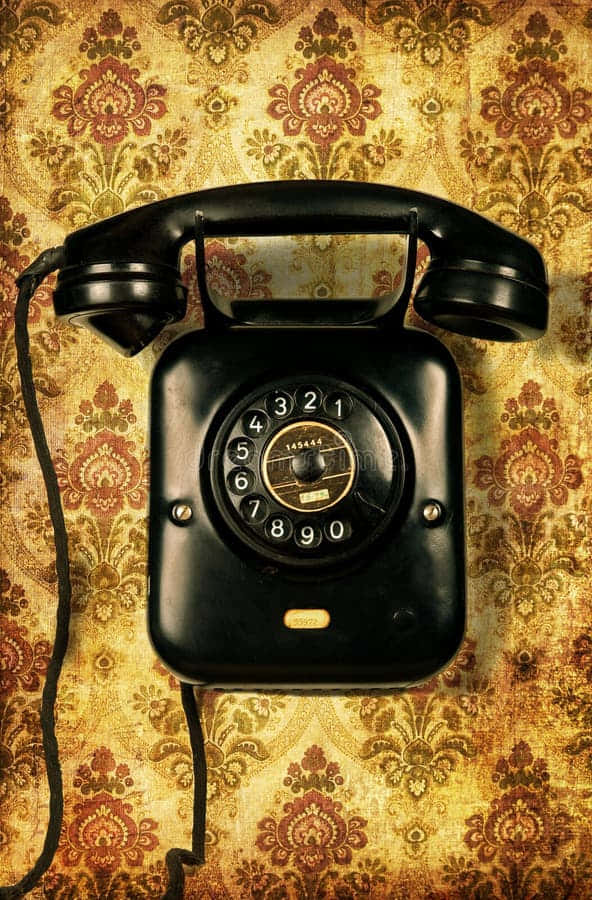 Vintage Black Rotary Telephoneon Floral Background.jpg Wallpaper