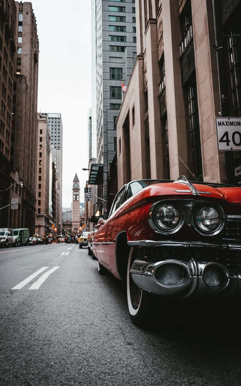 Vintage Car In Metropolis Wallpaper