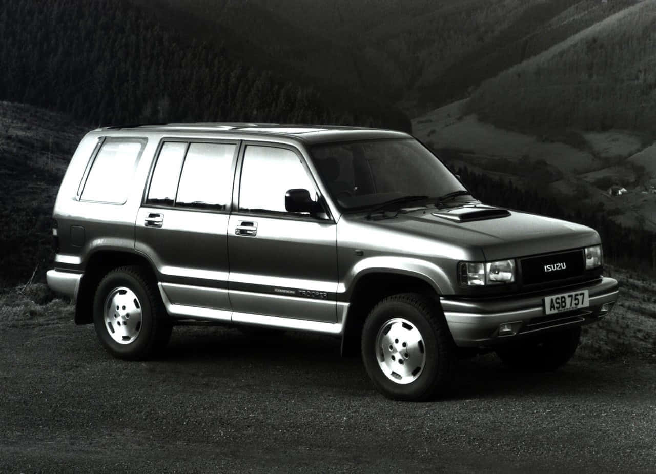 Vintage Isuzu Rodeo S U V Mountain Backdrop Wallpaper