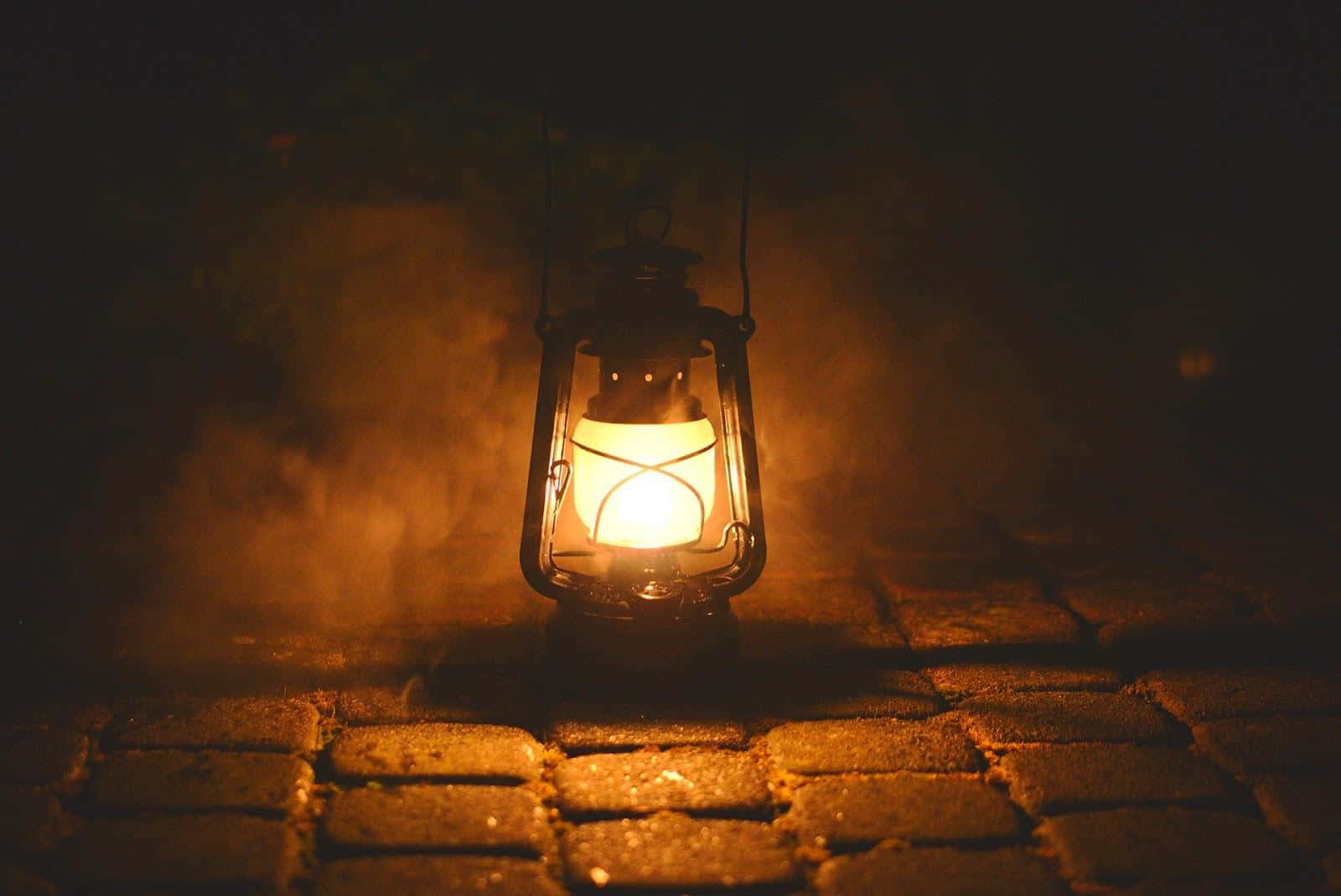 Vintage Lantern Glowingin Dark Wallpaper