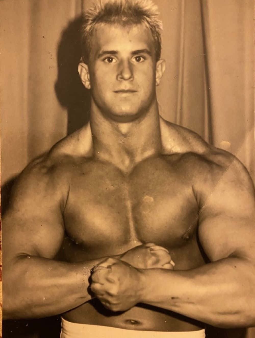 Vintage Muscular Man Posing Sepia Tone Wallpaper