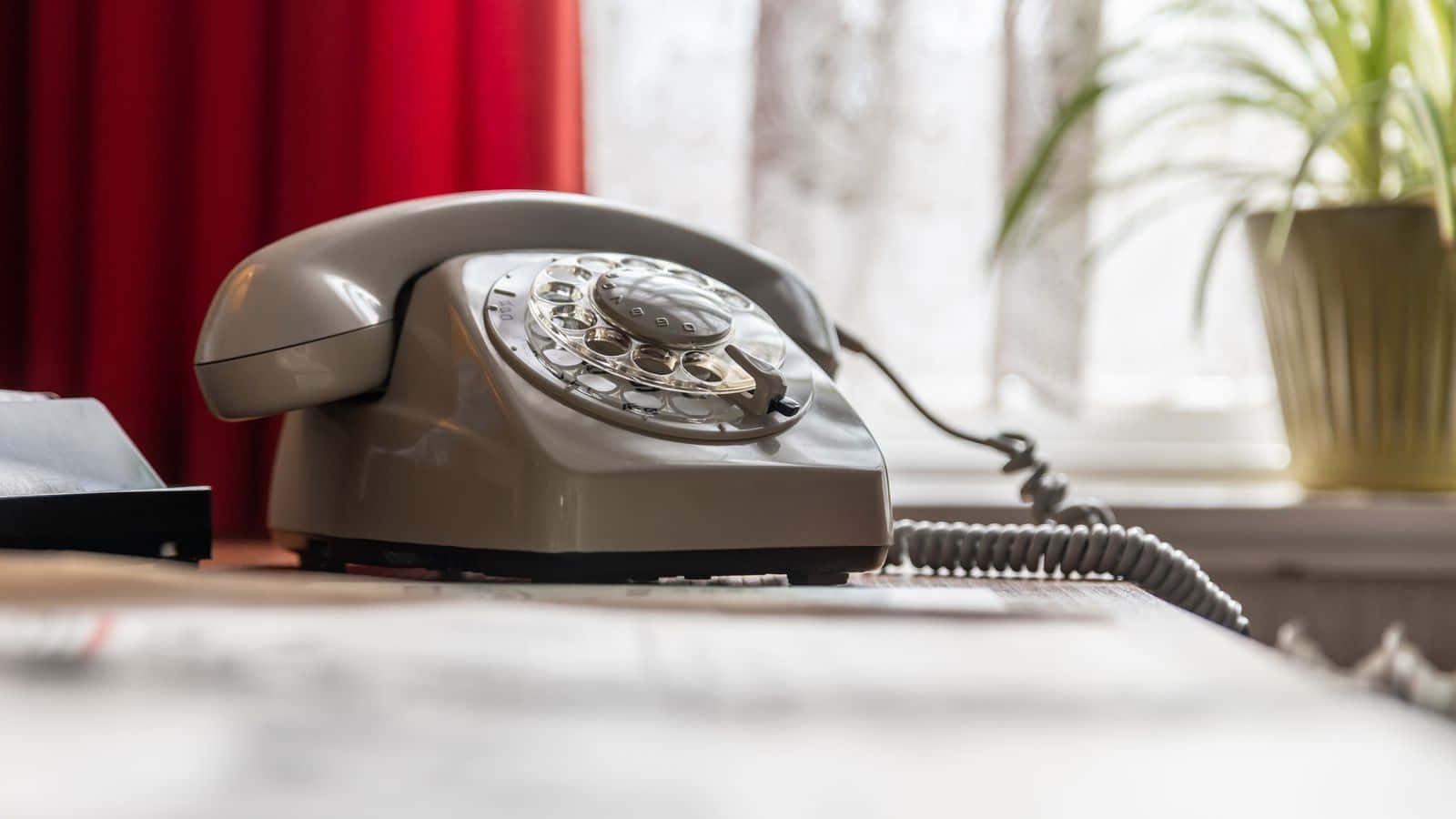 Vintage Rotary Phoneon Desk Wallpaper