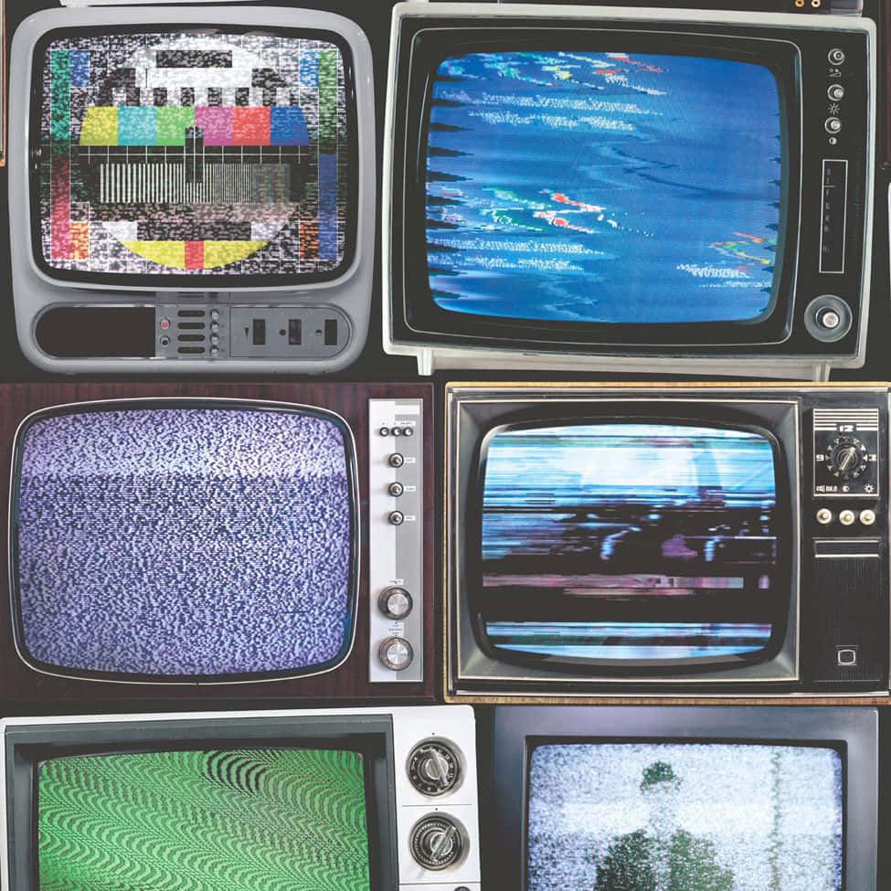 Vintage T V Screens Displaying Staticand Test Patterns Wallpaper