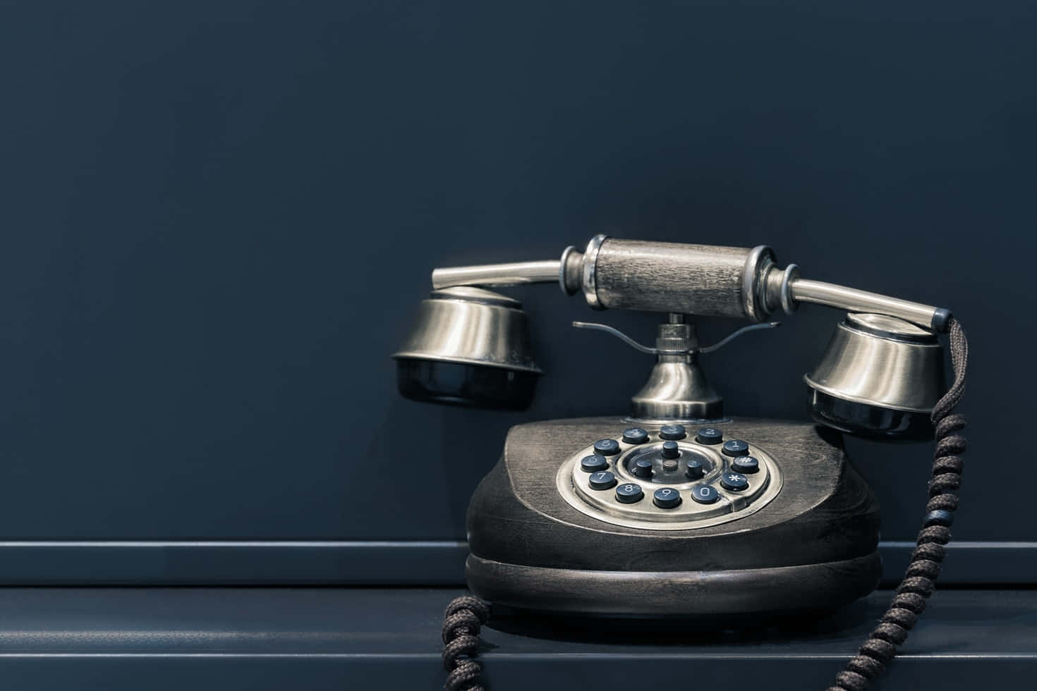 Vintage Telephoneon Desk Wallpaper