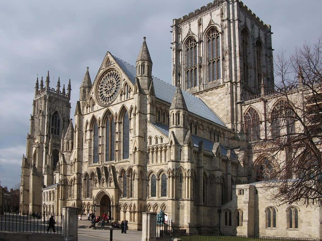 Visitors Entering The Historic York Minster Cathedral Wallpaper