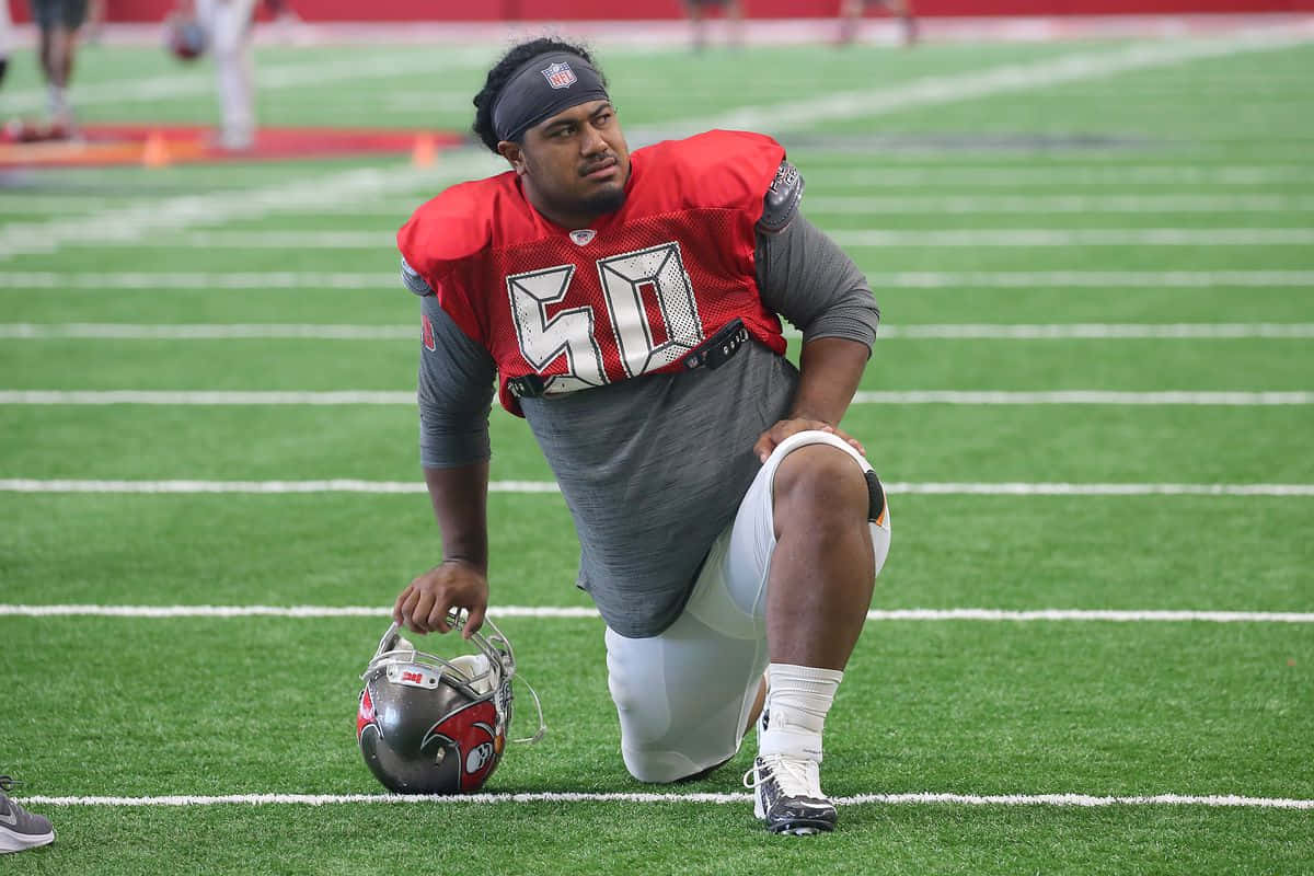 Vita Vea Kneeling During Practice Wallpaper