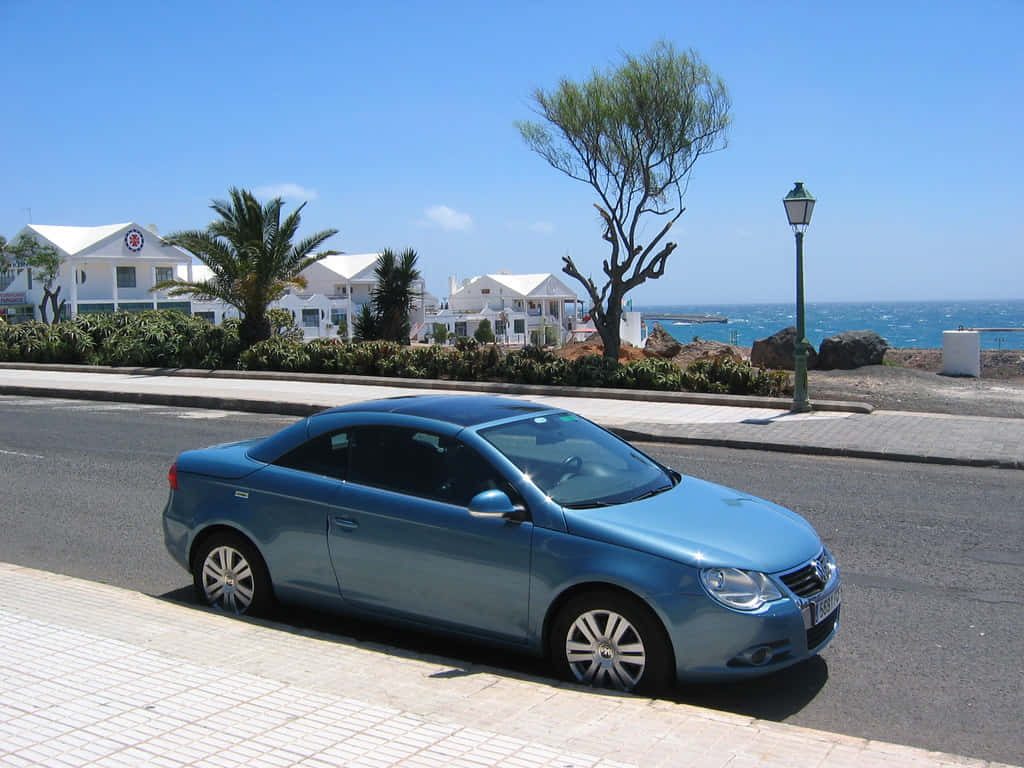 Volkswagen Eos Blue Coastal Road Wallpaper