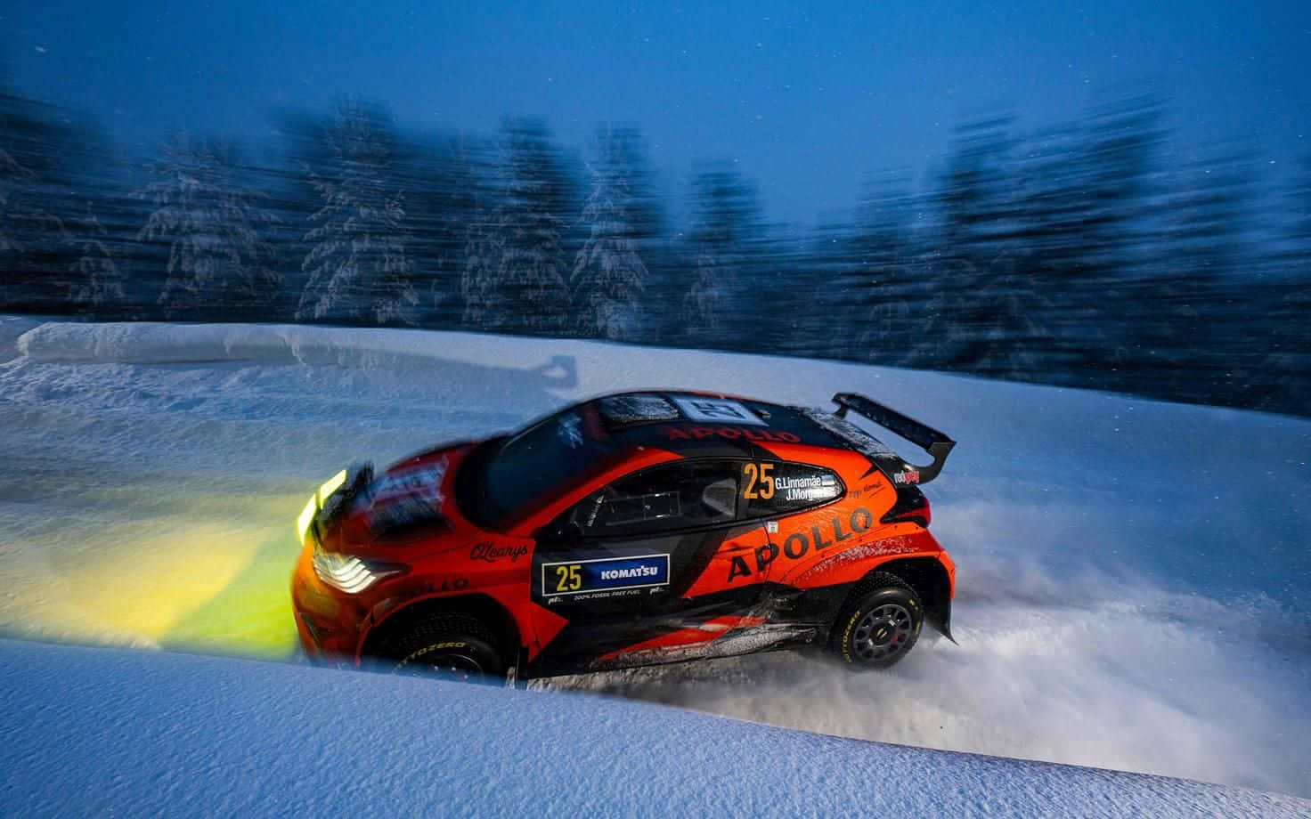 W R C Rally Car Speeding Through Snowy Track Wallpaper