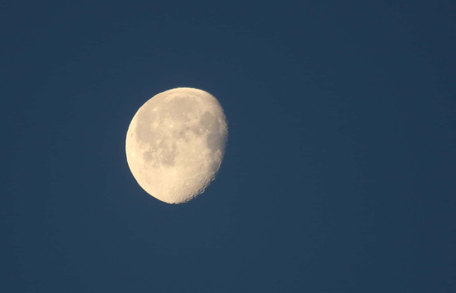 Waning Gibbous Moonin Blue Sky Wallpaper