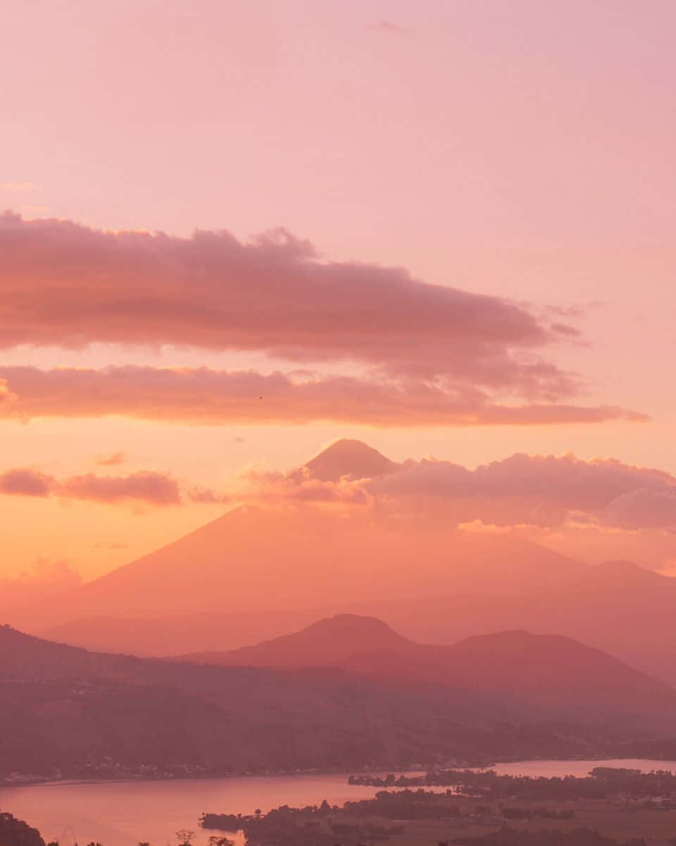 Warm Sunset Over Mountain Lake Wallpaper