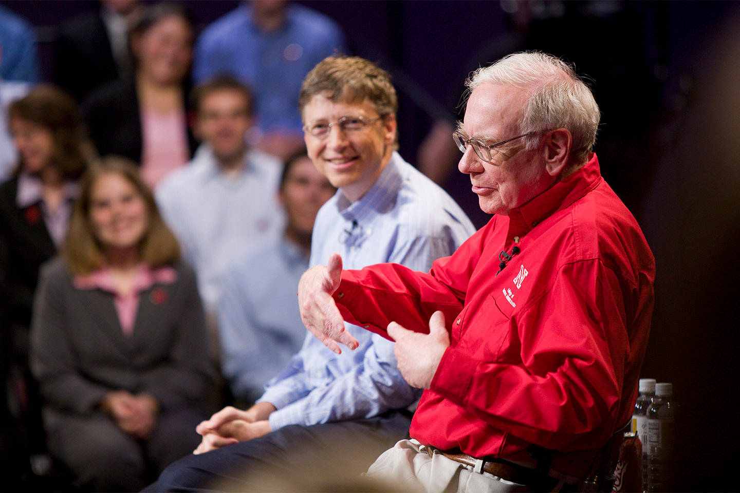 Warren Buffett Delivering An Insightful Speech On Investment Wallpaper