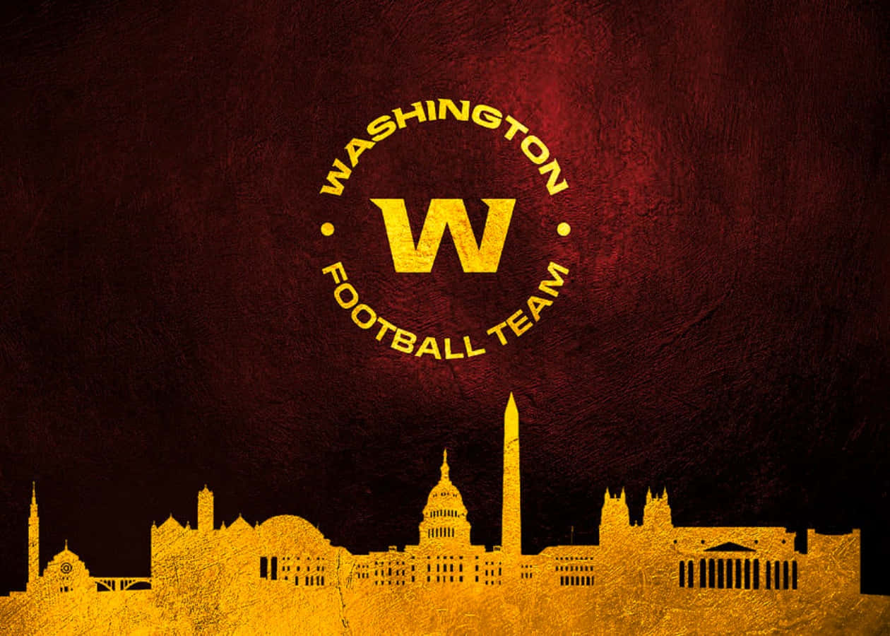 Washington Football Team In Action On A Vibrant Stadium Field Wallpaper