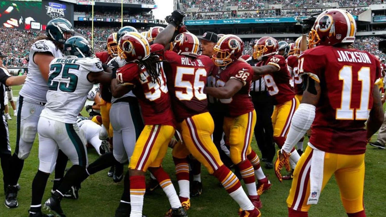 Washington Football Team Players Celebrating Victory On The Field Wallpaper