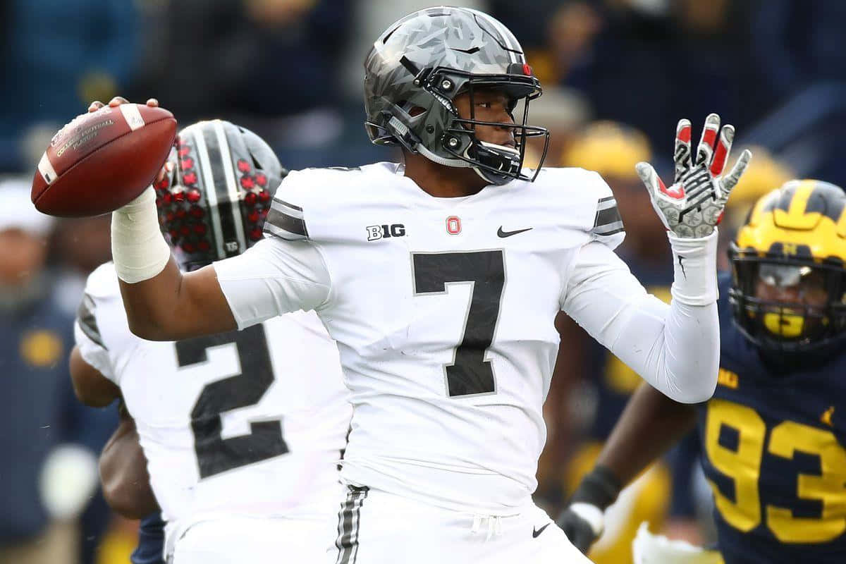 Washington Football Team Quarterback Dwayne Haskins Taking The Field Wallpaper