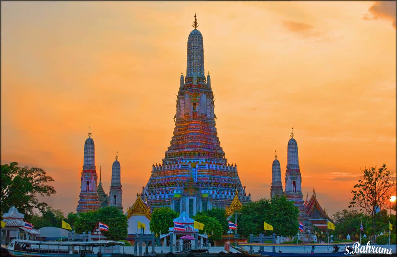 Wat Arun Against An Orange Sky Wallpaper