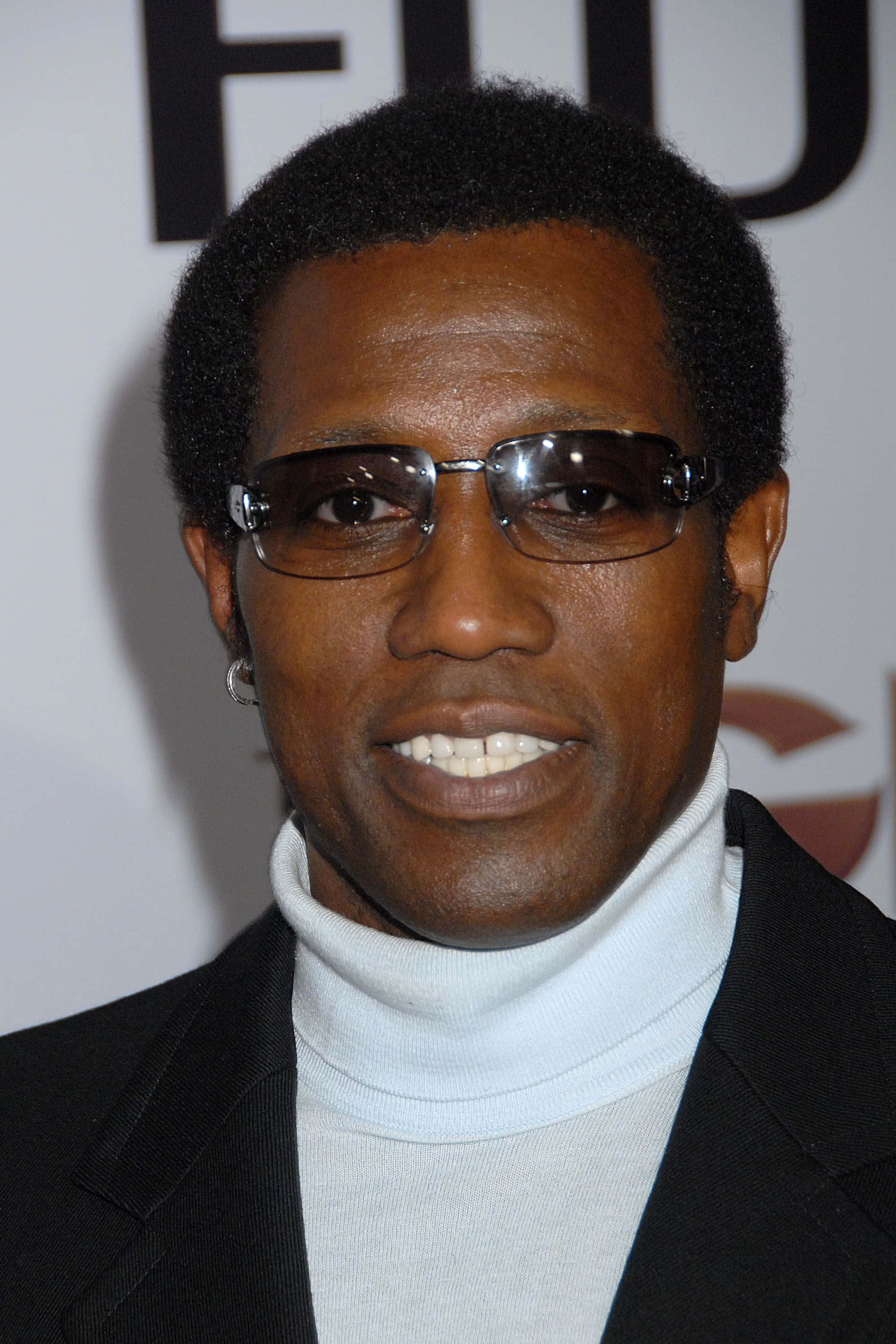 Wesley Snipes Exuding Confidence In A Sleek Black Suit Wallpaper