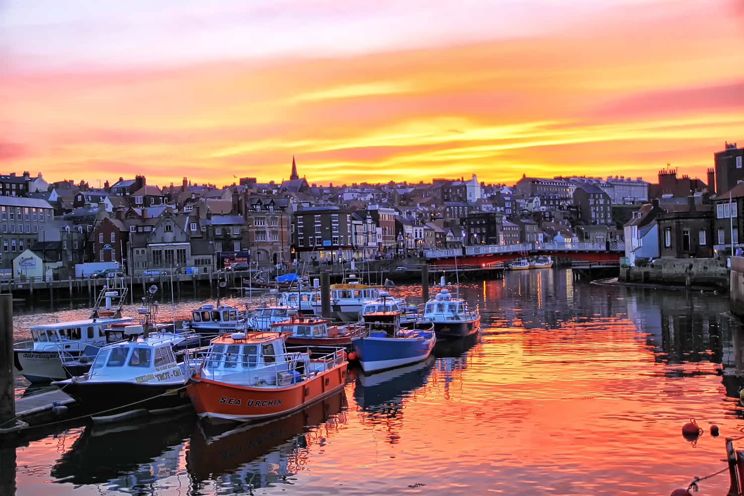 Whitby's Majestic Sunset Over The Harbor Wallpaper