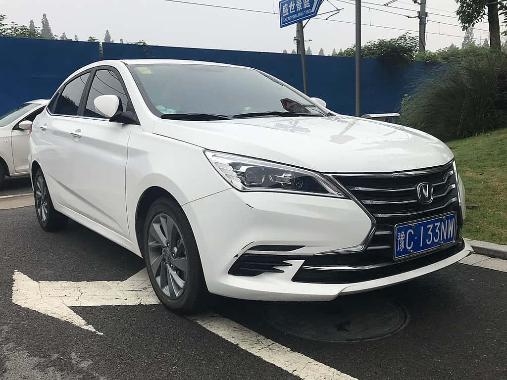 White Changan Eado Sedan Parked Outdoors Wallpaper