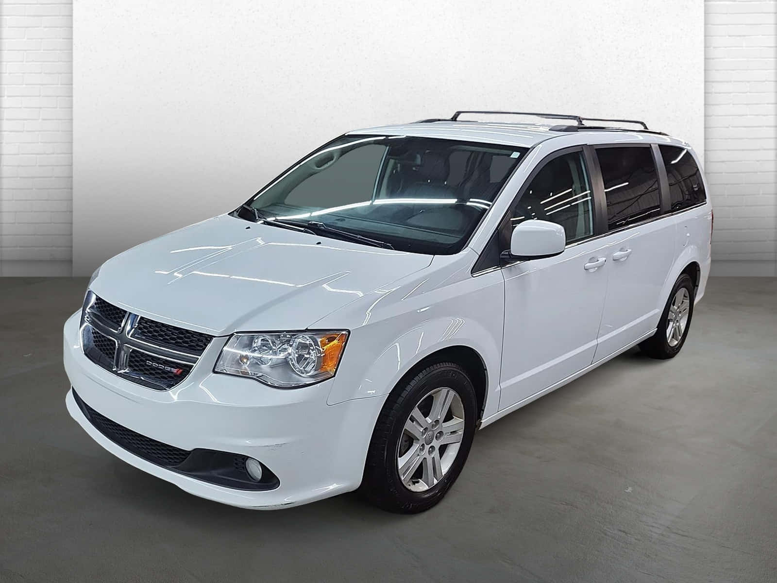 White Dodge Grand Caravanin Showroom Wallpaper