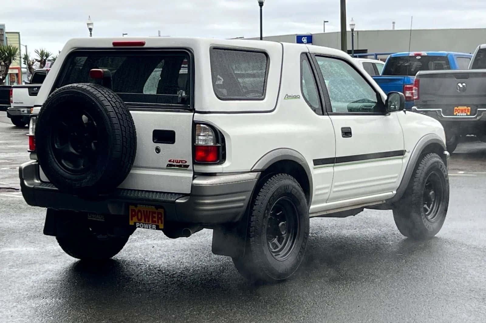 White Isuzu Amigo Parked Outdoors Wallpaper