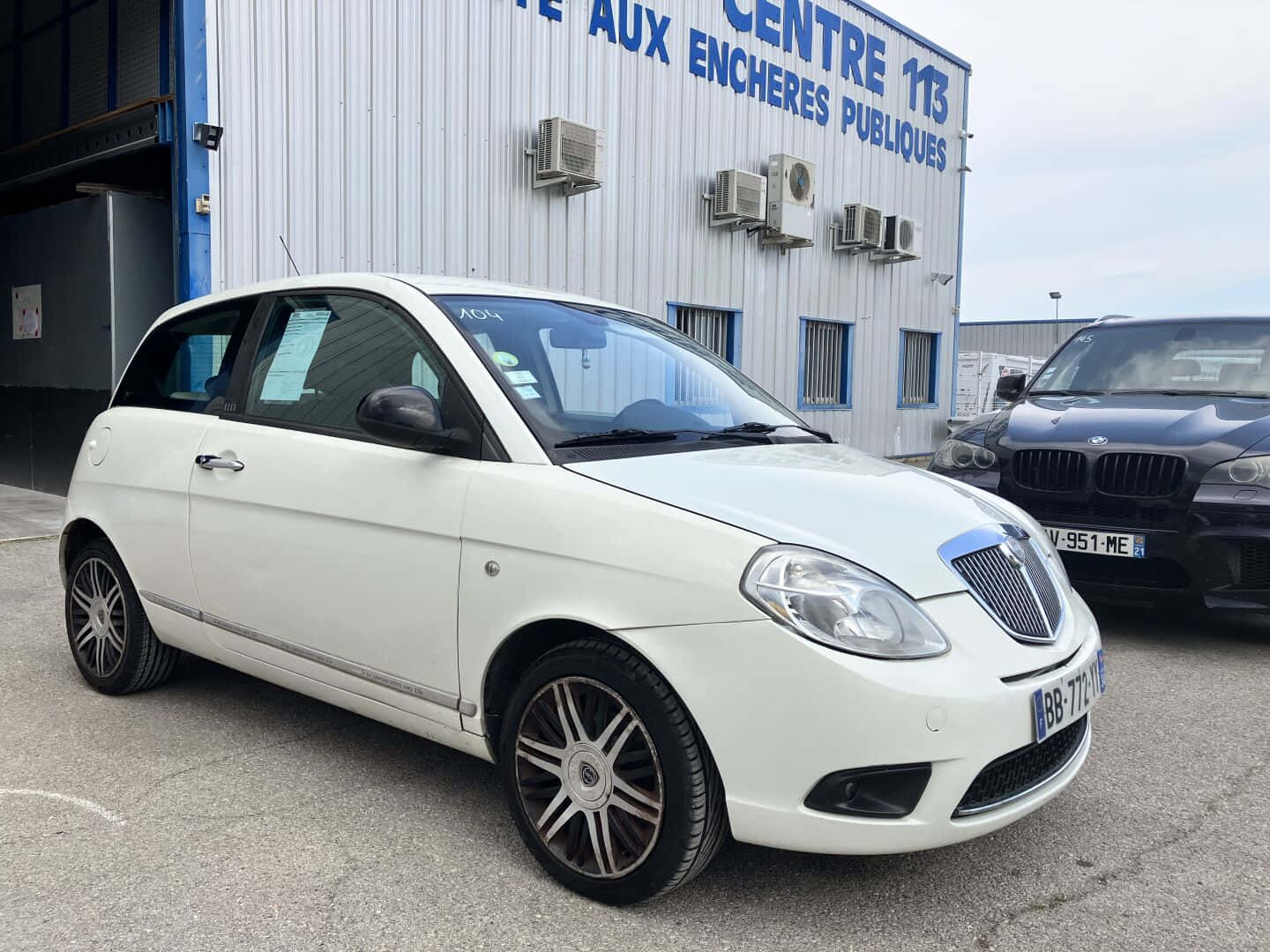 White Lancia Ypsilon Parked Outdoors Wallpaper