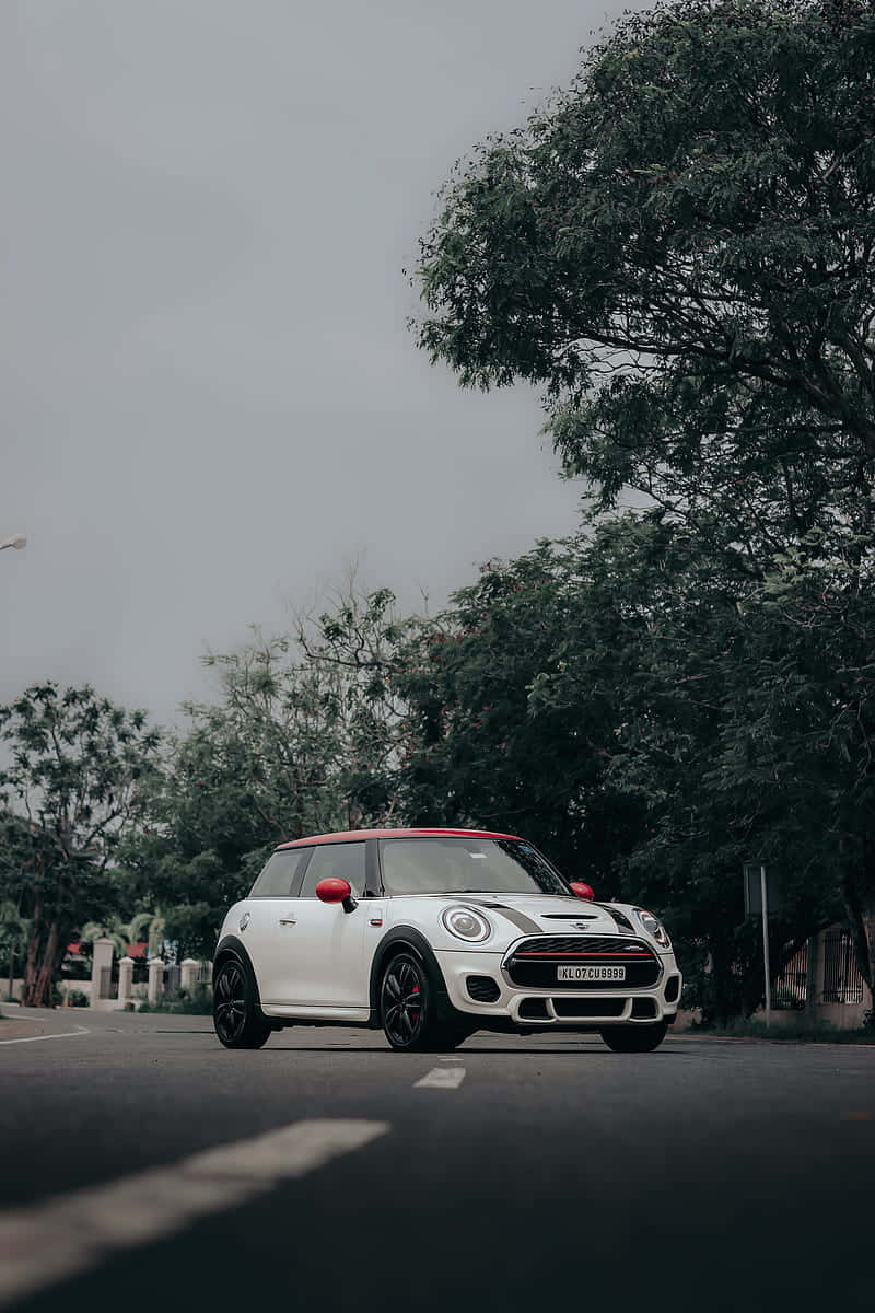 White Mini Cooper S E Parked Outdoors Wallpaper