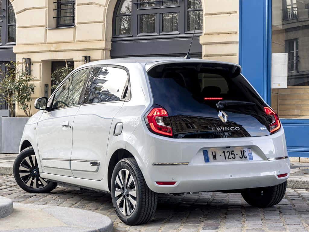 White Renault Twingo Urban Setting Wallpaper