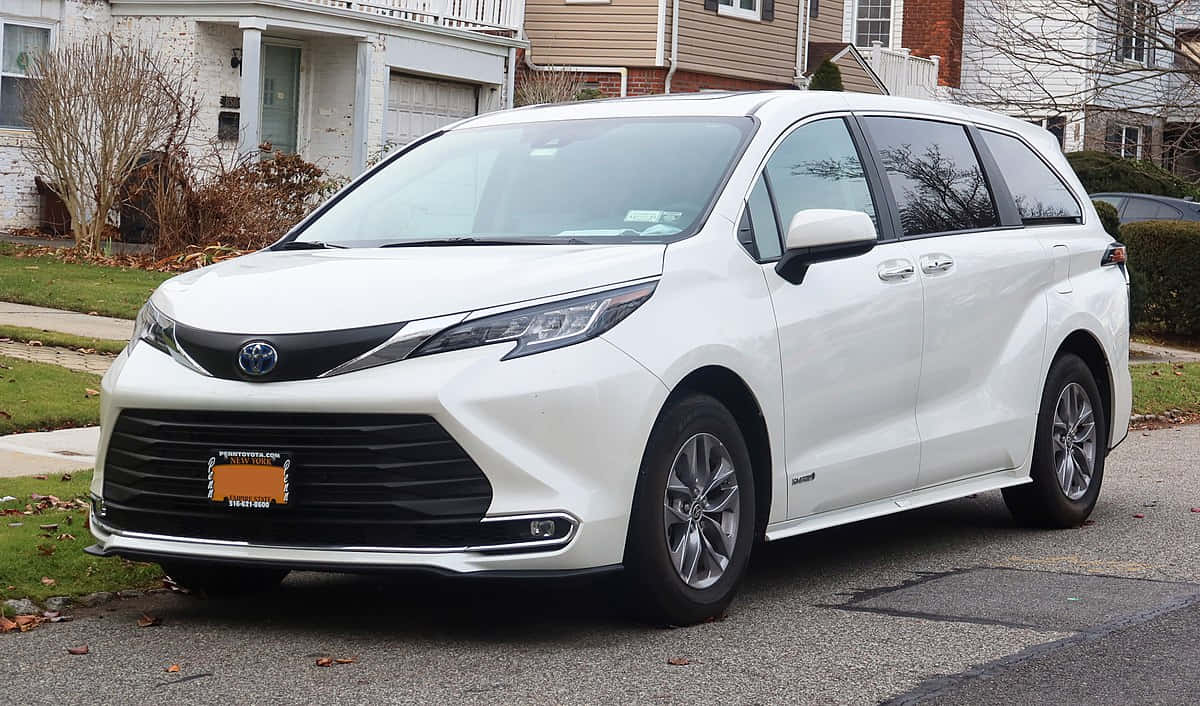 White Toyota Sienna Parked Residential Area Wallpaper