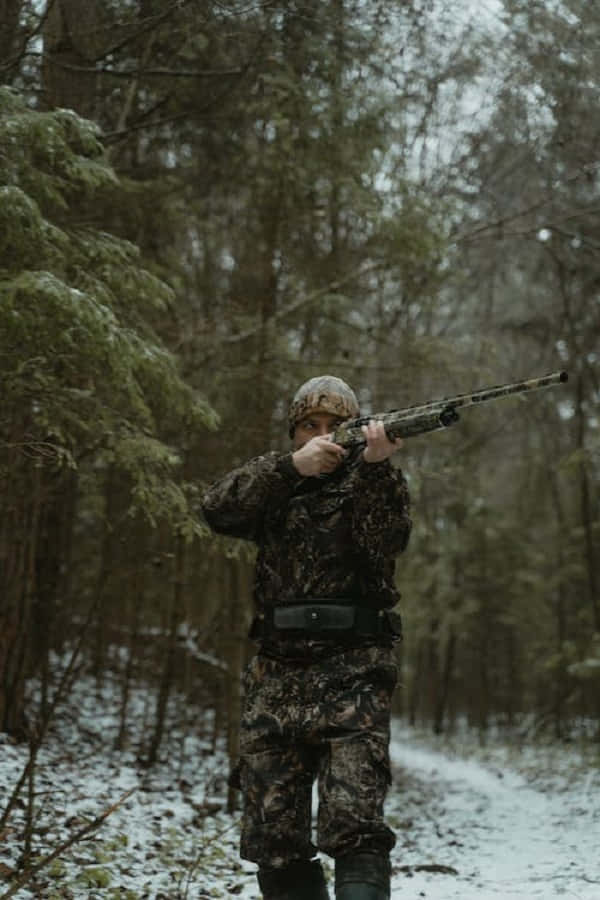 Winter Adventure Awaits - Snowshoes Beautifully Laid Out In A Snowy Forest Wallpaper