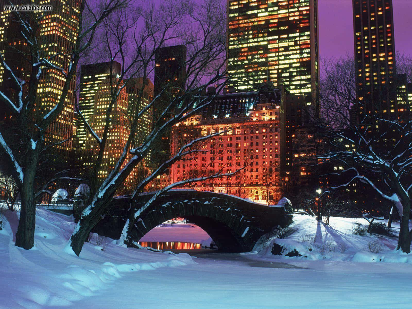 Winter City Evening: Snow-covered Buildings And Streets Wallpaper