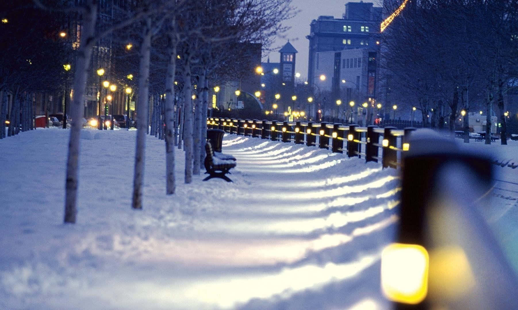 Winter Cityscape With Snow Covered Streets Wallpaper