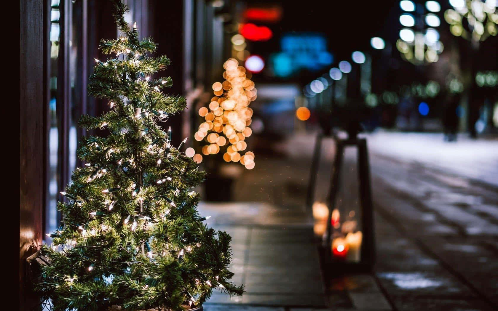 Winter Cityscape With Snowy Streets And Buildings Wallpaper