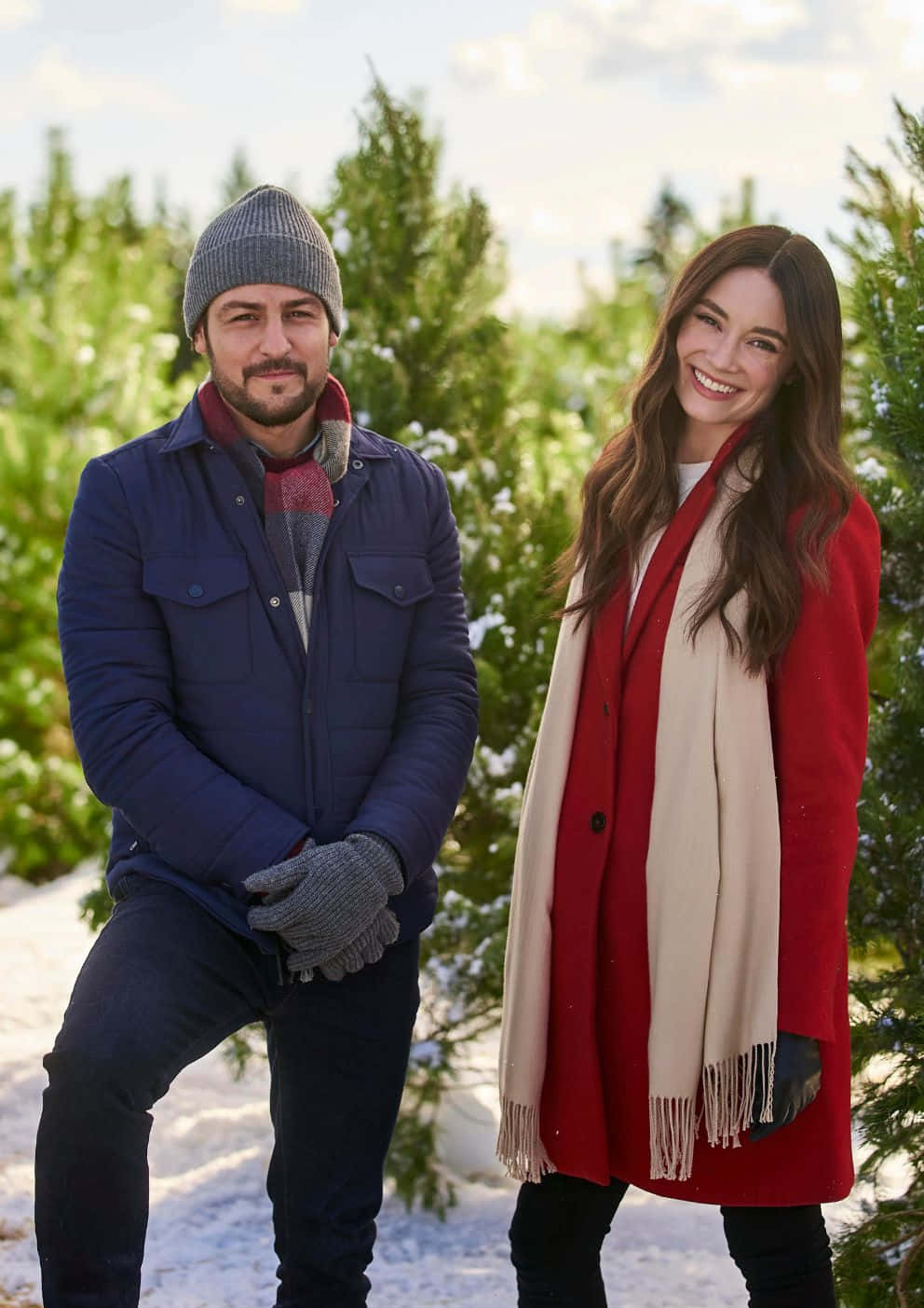 Winter Couple Portraitin Snowy Christmas Tree Farm Wallpaper