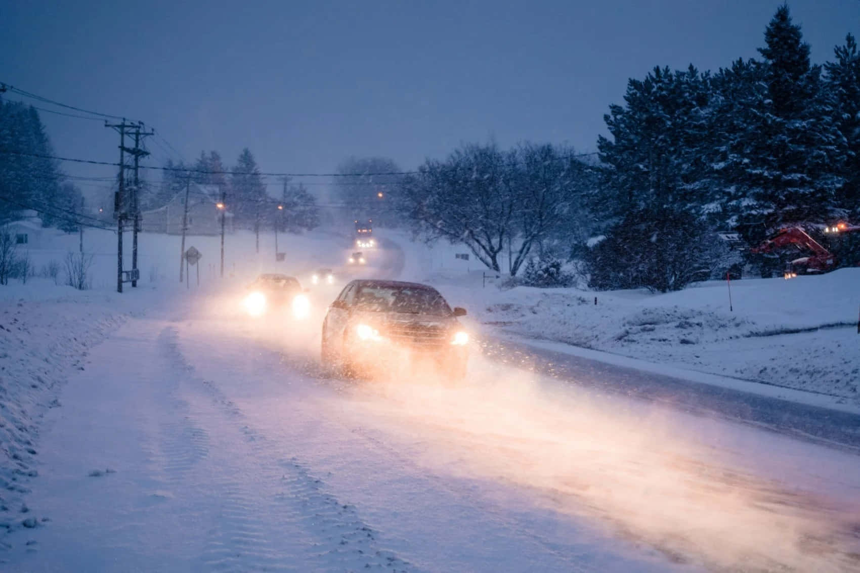 Winter Driving On A Snowy Road Wallpaper