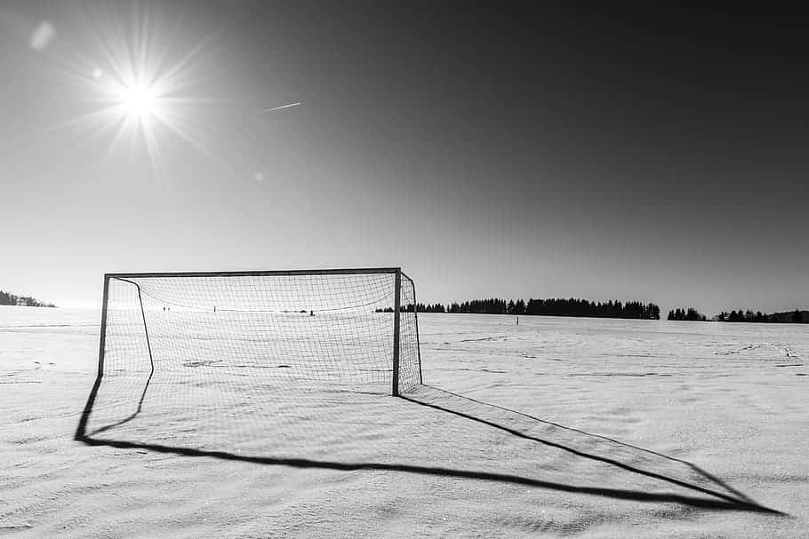 Winter Soccer Goal Sunburst Wallpaper