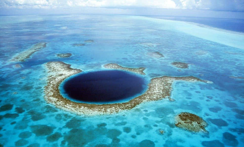 Witness The Magnificent Blue Holes Of Belize Wallpaper