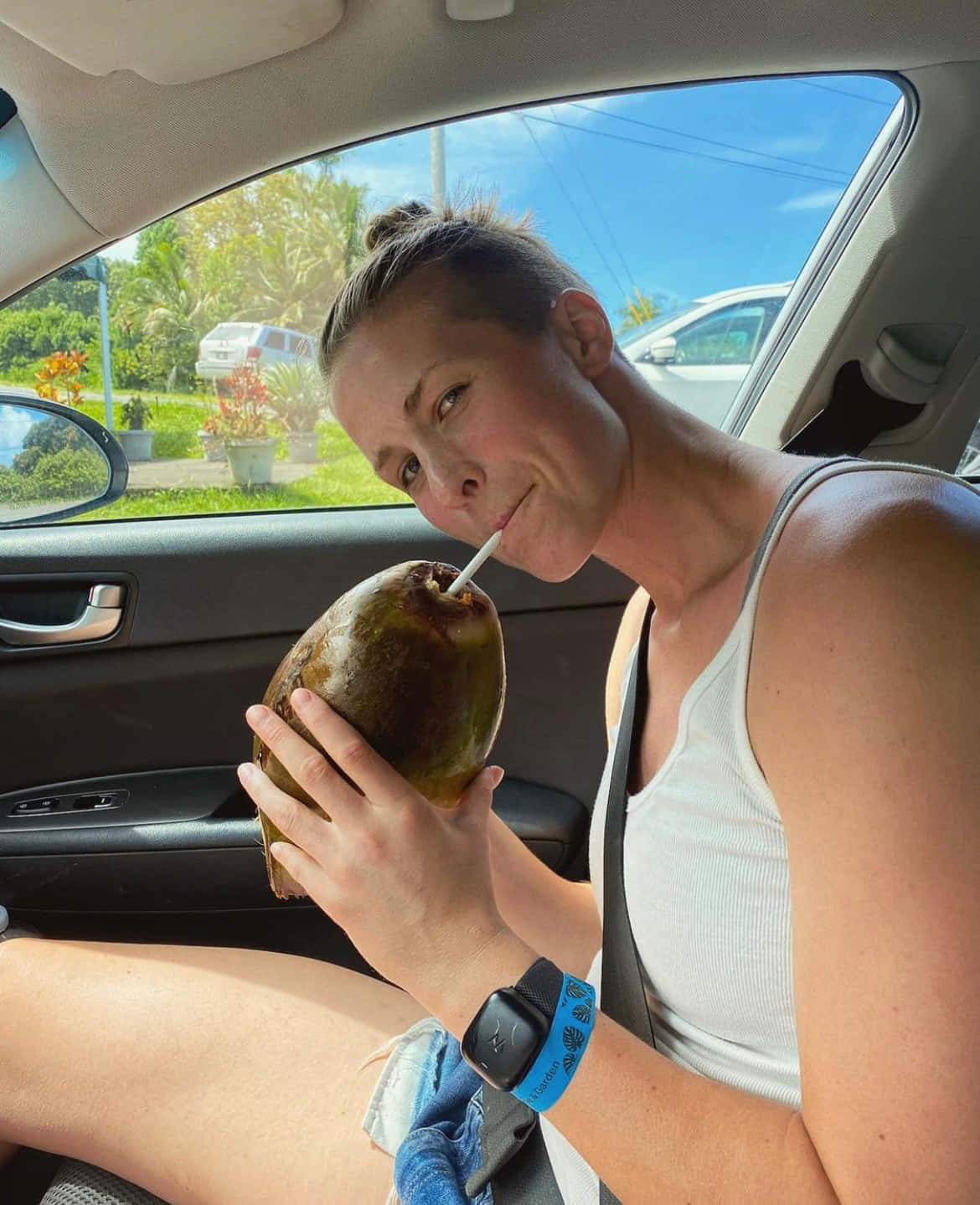 Woman Drinking Coconut Waterin Car Wallpaper