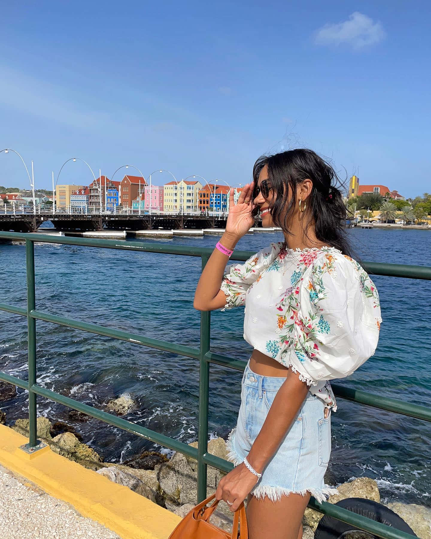 Woman Enjoying Seaside Promenade Wallpaper