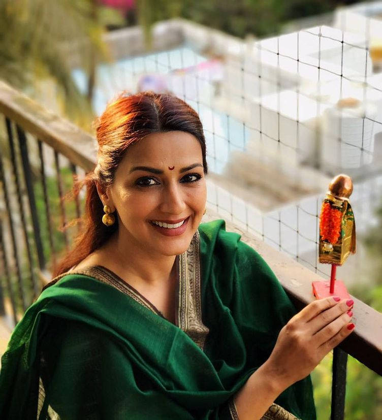 Woman Holding A Gudi Padwa Showpiece Wallpaper