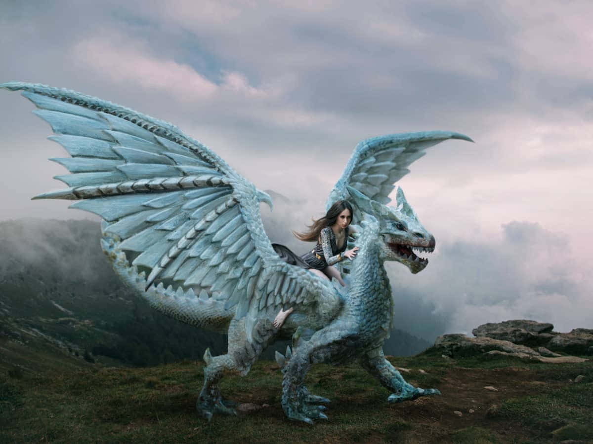 Woman_ Riding_ Ice_ Dragon_ Mountain_ Top Wallpaper