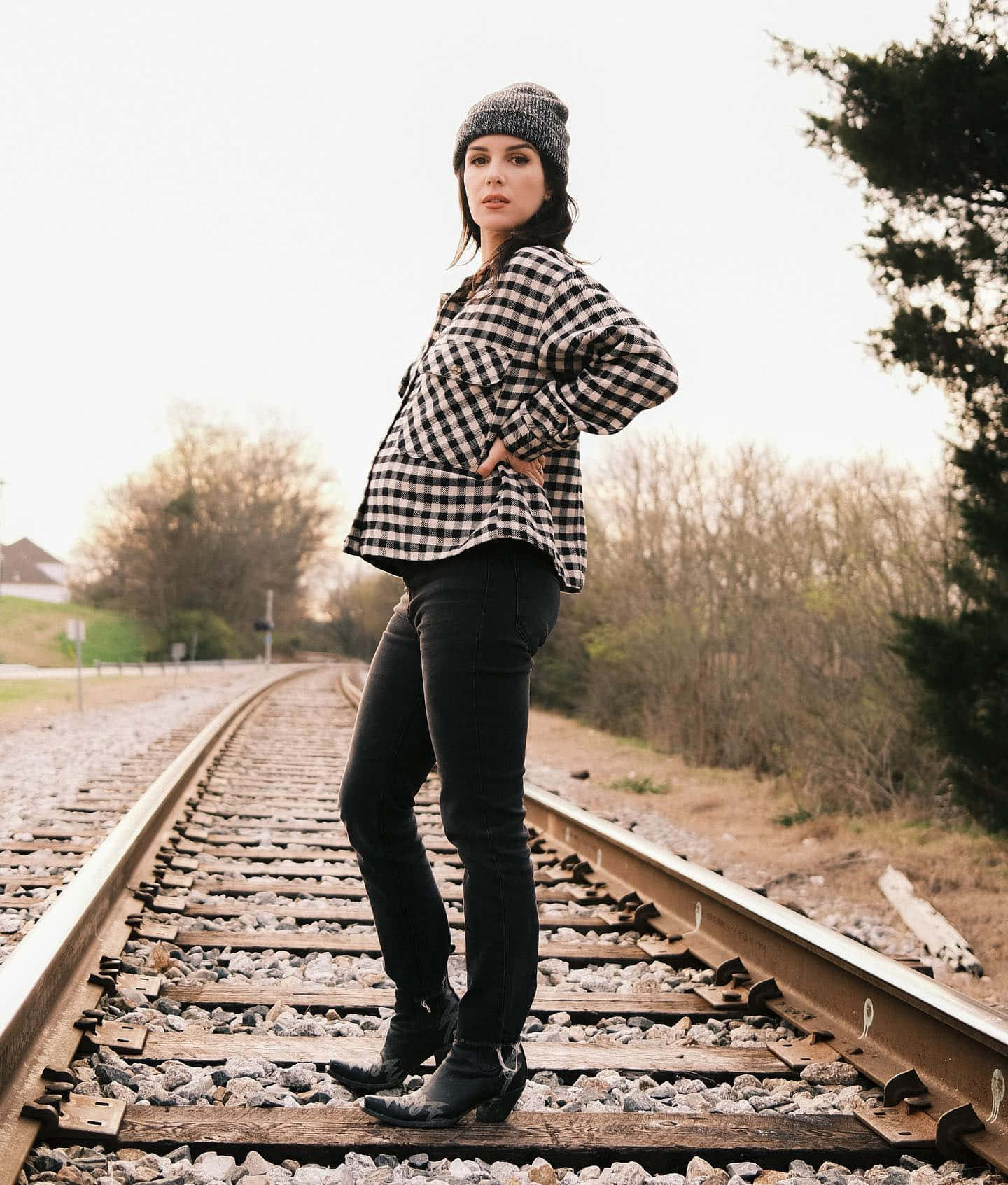 Woman Standingon Railroad Tracks Wallpaper