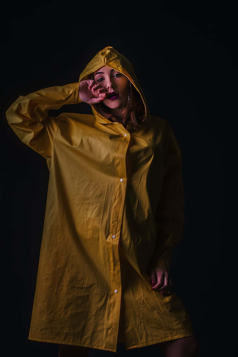 Woman Wearing A Vibrant Yellow Raincoat Wallpaper