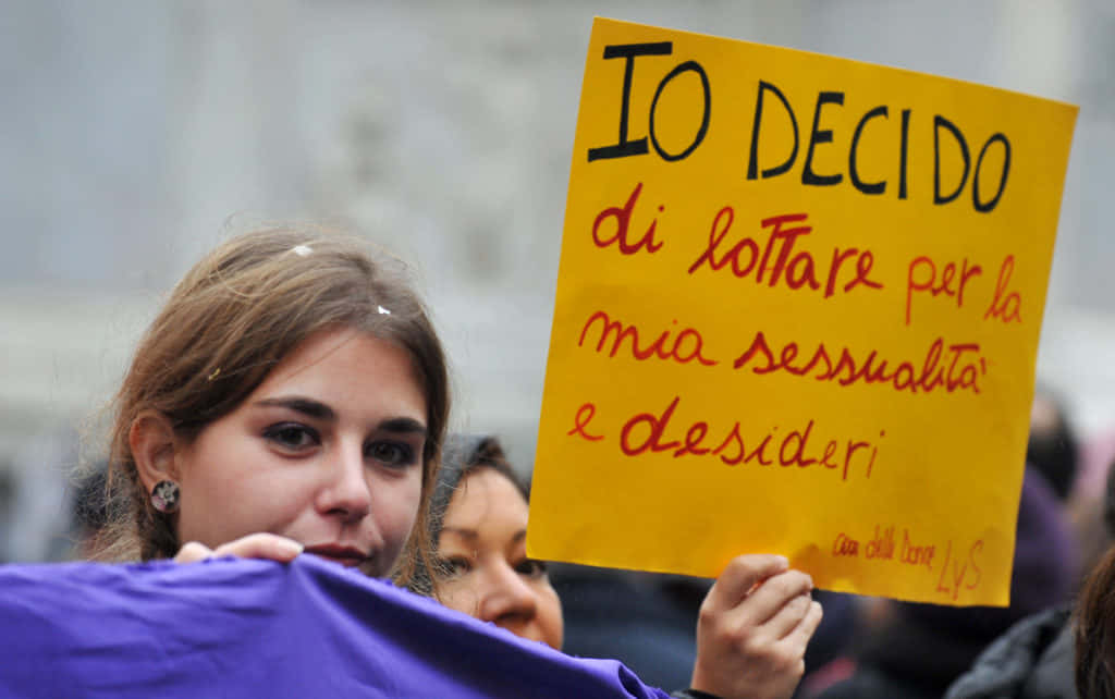 Woman With Yellow Placard About Abortion Rights Wallpaper