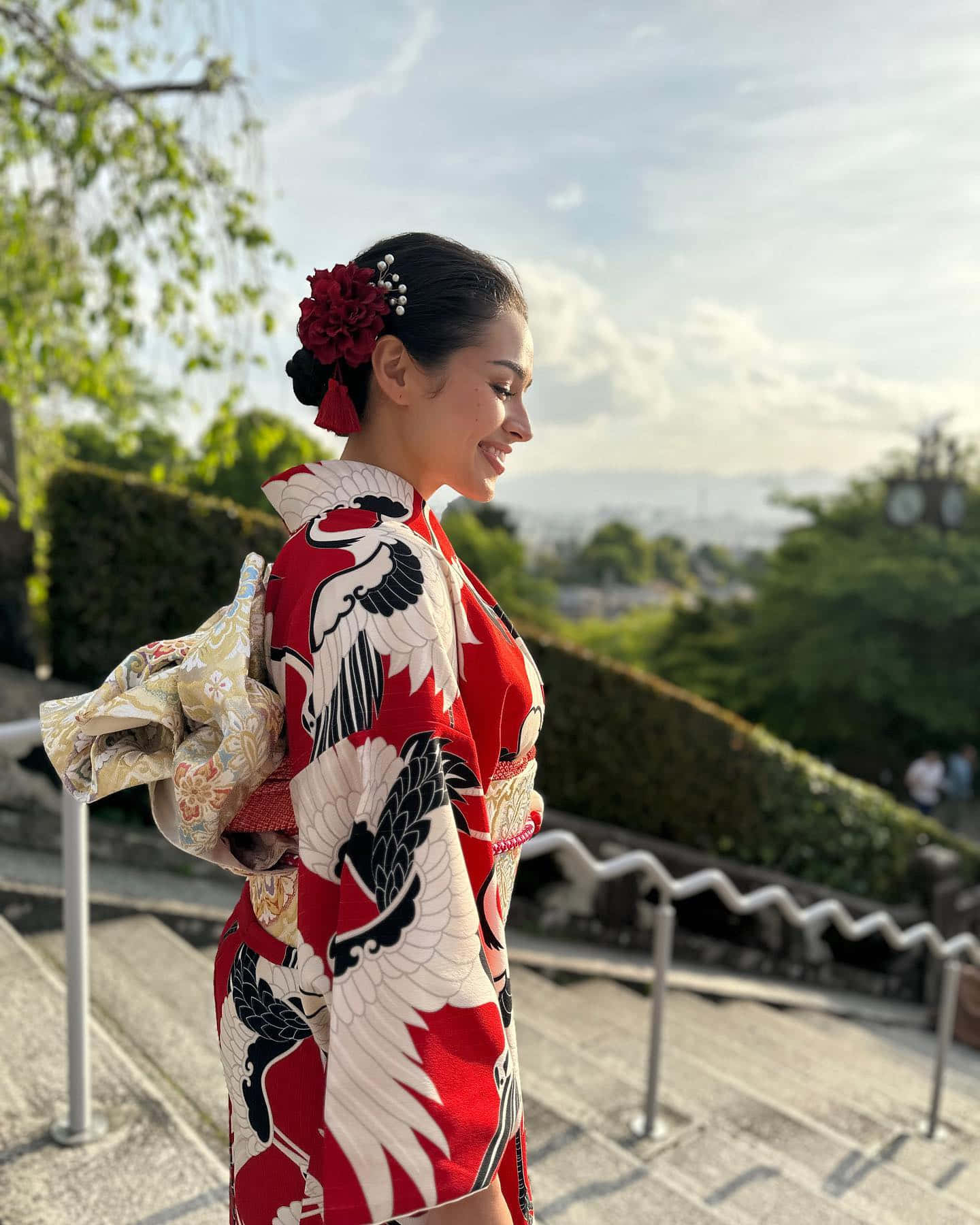 Womanin Red Kimono Overlooking Cityscape Wallpaper