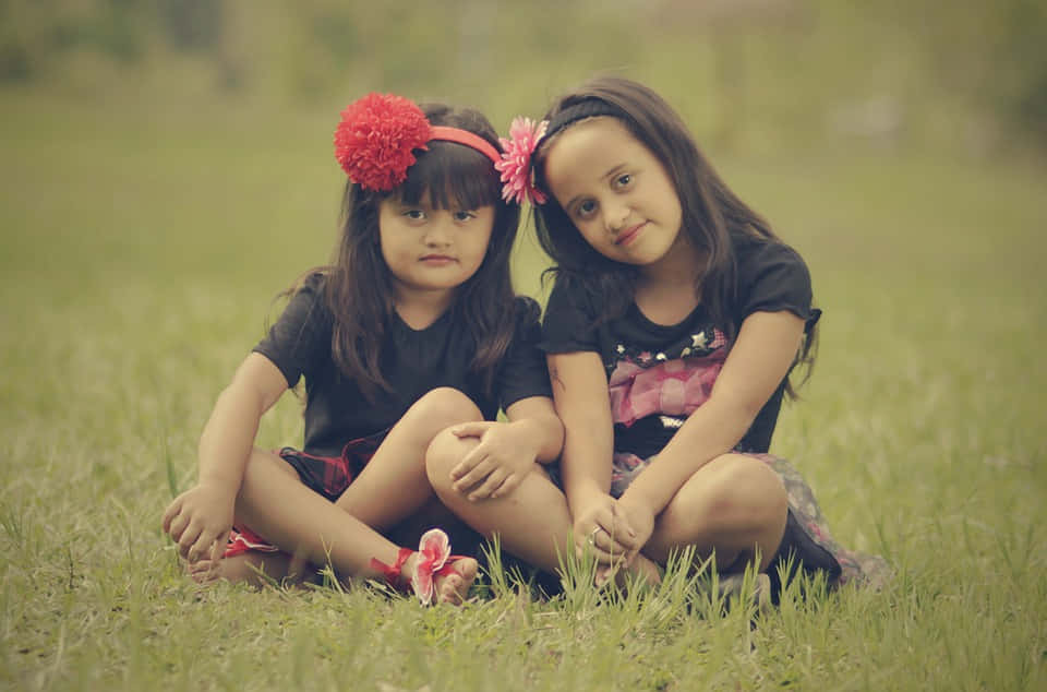 Wonderful Portrait Of Sweet Cute Sisters Wallpaper